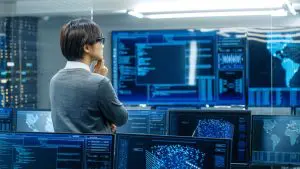 Person looking at computer screens