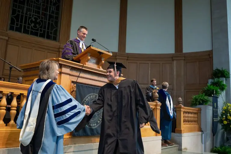 Student Shaking the Dean's Hand