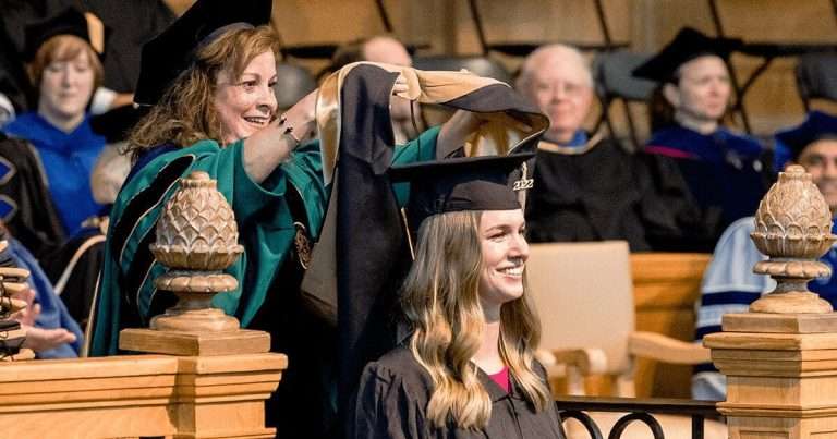 Women smiling at graduation