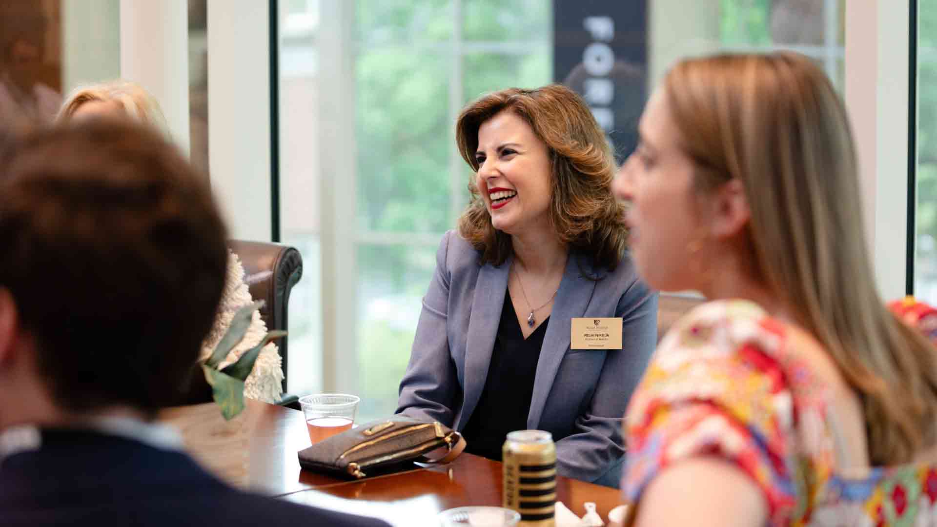 Women Smiling in a Meeting