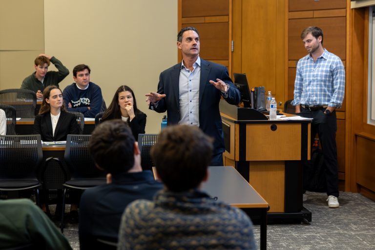 Joe Alala speaks with finance students in Farrell Hall