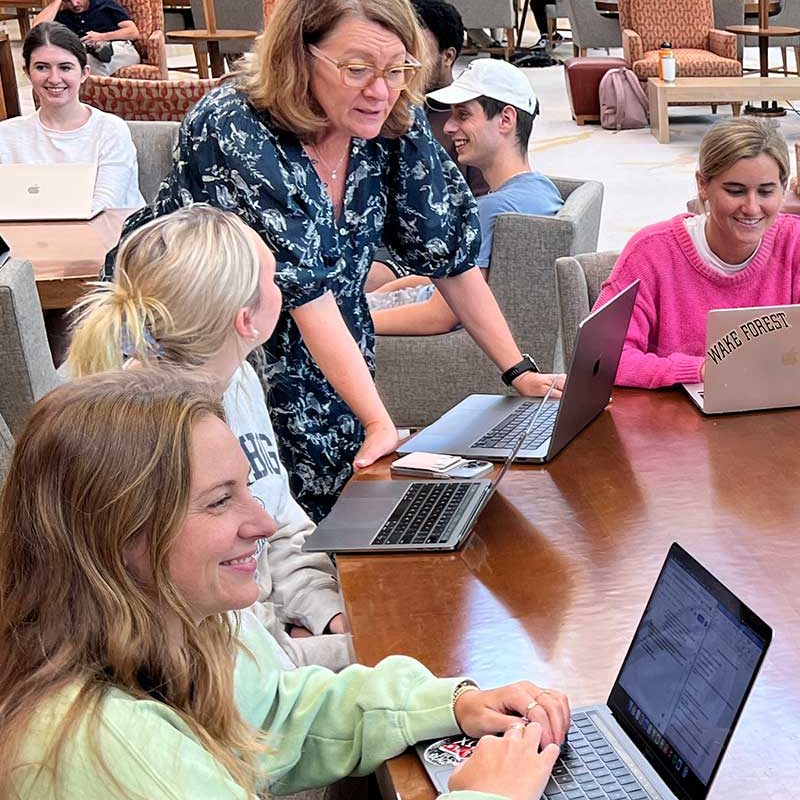 Students mingling with advisor on SMP Consult Day