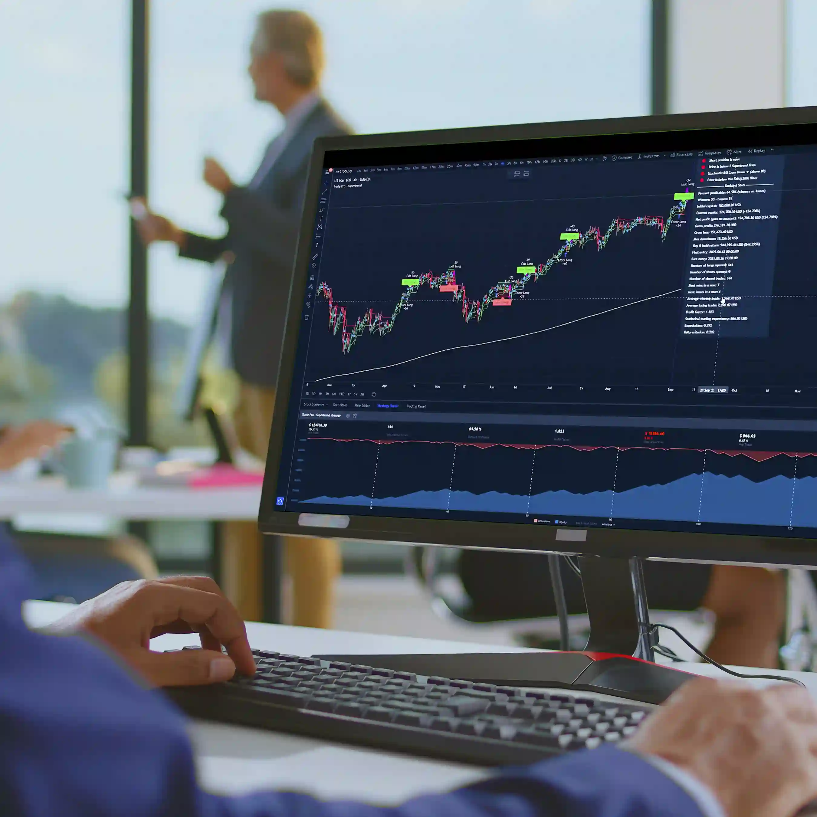 A cropped photo of a man reviewing data on screen in the midst of his business analytics review.